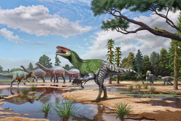The meat-eating dinosaur Invictibellatrix amberina feeds on a mammal while grasping another in its ecosystem alongside other dinosaurs and other kinds of animals on the Isle of Wight, United Kingdom, in the Cretaceous Period around 120 million years ago, in this illustration released on October 13, 2026. Sergey Krasovskiy and Pedro Salas/Handout via REUTERS