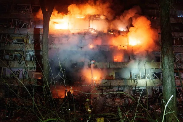 A damaged multi-story residential building is seen on fire after a Russian missile strike on Kyiv, Ukraine, Tuesday, Oct. 13, 2026. (AP) 