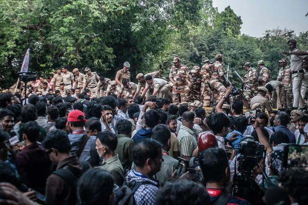 12 October 2026, India, New Delhi: Protestors confront the police during a demonstration by members of the Cockroach Janta Party (CJP) and the All India Students' Federation (AISF) at Jantar Mantar in New Delhi demanding the resignation of Chief Election Commissioner Gyanesh Kumar over alleged irregularities in electoral rolls. Photo: Yousuf Sarfaraz/SOPA Images via ZUMA Press Wire/dpa