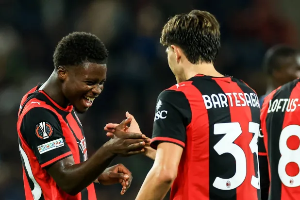 AC Milan's Alphadjo Cisse (L) celebrates with Davide Bartesaghi of AC Milan after scoring the 2-0 lead during the UEFA Europa League match-day 2 between FC Salzburg and AC Milan, Austria, 15 October 2026. (EPA)