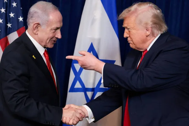 US President Donald Trump points his finger towards Israeli Prime Minister Benjamin Netanyahu as they shake hands during a press conference after meeting at Trump’s Mar-a-Lago club in Palm Beach, Florida, US, December 29, 2025. (Reuters)