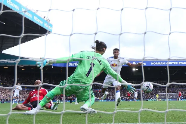 Bryan Mbeumo of Manchester United scores the 0-1 goal past James Trafford of Leeds United during the English Premier League match between Leeds United and Manchester United, in Leeds, Britain, 18 October 2026. (EPA)