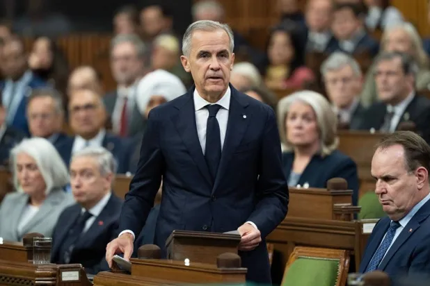  Canadian Prime Minister Mark Carney speaks about the incident at CFB Wainwright as he rises in the House of Commons in Ottawa, Monday, Oct. 19, 2026. (Adrian Wyld/The Canadian Press via AP) 