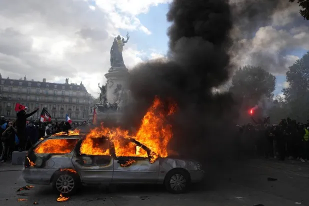  A car burns at Republique square during a protest against rising living costs, joining students' grievances, in Paris, Saturday, Oct. 17, 2026. (AP) 