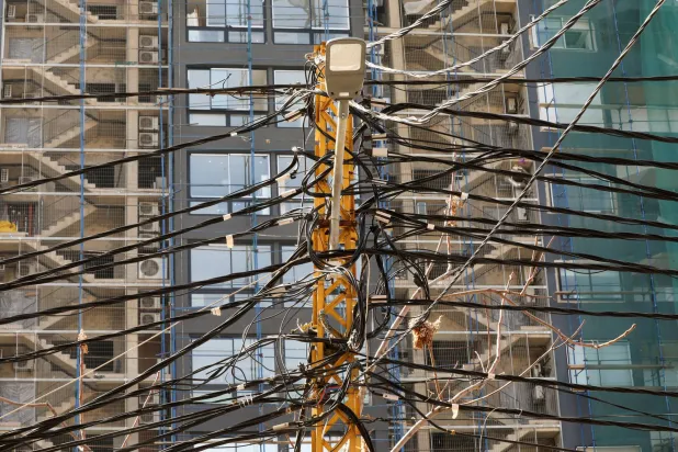 A view shows electricity cables attached to a utility pole in Beirut, Lebanon February 18, 2022. (Reuters)