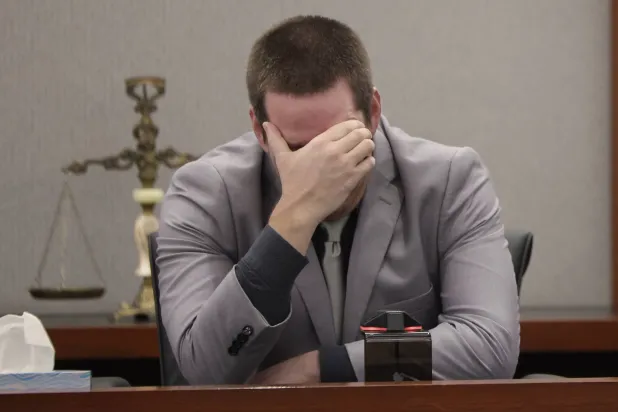 Mitchell Fairbarn breaks down while testifying during his trial at the Regional Justice Center Friday, Oct. 16, 2026, in Las Vegas. (Benjamin Hager/Las Vegas Review-Journal via AP)