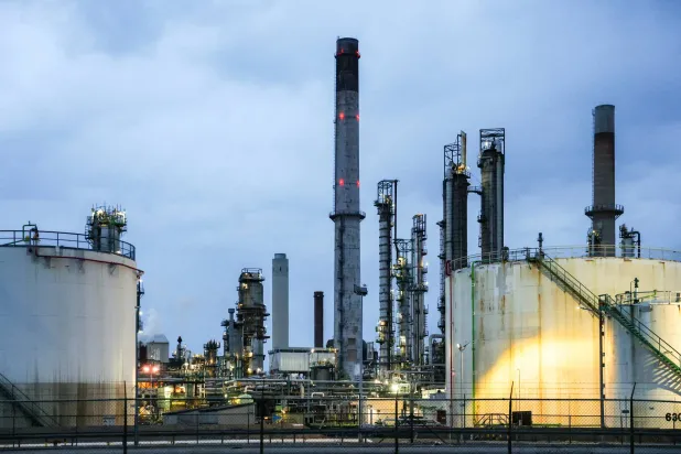 Oil tanks and chimneys at ExxonMobil refining and petrochemicals platform in Rotterdam, Netherlands April 9, 2026. (Reuters)