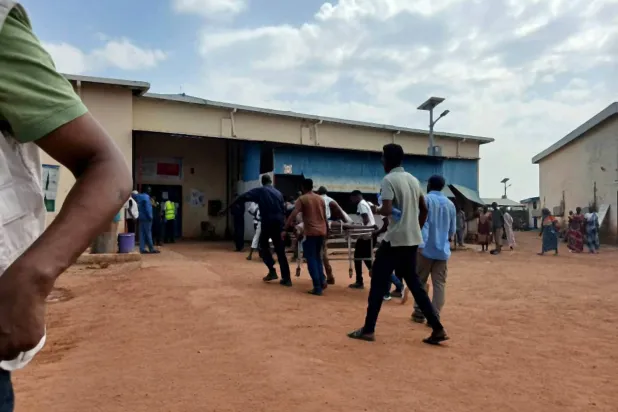 A person wounded in a drone strike on a market in the disputed Abyei region along the border between South Sudan and Sudan is carried to Ameth Bek hospital, October 20, 2026. (Reuters/Medecins Sans Frontieres/Handout) 