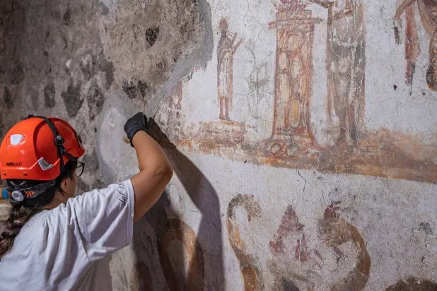  In this undated handout photo provided on Tuesday, Oct. 20, 2026, by the Pompeii Archaeological Park, restorers work inside the House of Marcus Fabius Rufus in Pompeii, near Naples, Italy. (Silvia Vacca/ Pompeii Archaeological Park via AP) 