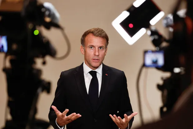 French President Emmanuel Macron gestures as he speaks to members of the media on the day of the 9th Annual One Planet Sovereign Wealth Funds (OPSWF) Summit, in Lusail, Qatar, 21 October 2026.  EPA/BENOIT TESSIER