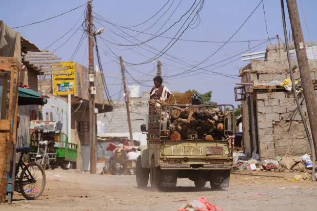 A truck loaded with firewood drives through the Al-Basateen neighborhood in Aden, Yemen, Tuesday, Oct. 13, 2026. (AP)