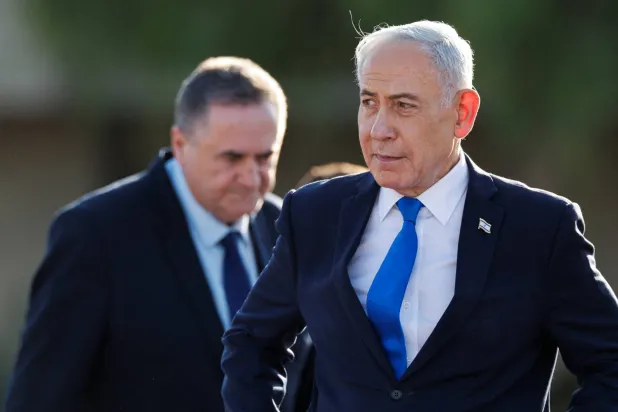 Israeli Prime Minister Benjamin Netanyahu and Defence Minister Israel Katz attend a graduation ceremony of new Israeli army officers at a base near Mitzpe Ramon, Israel, October 21, 2026. (Reuters)