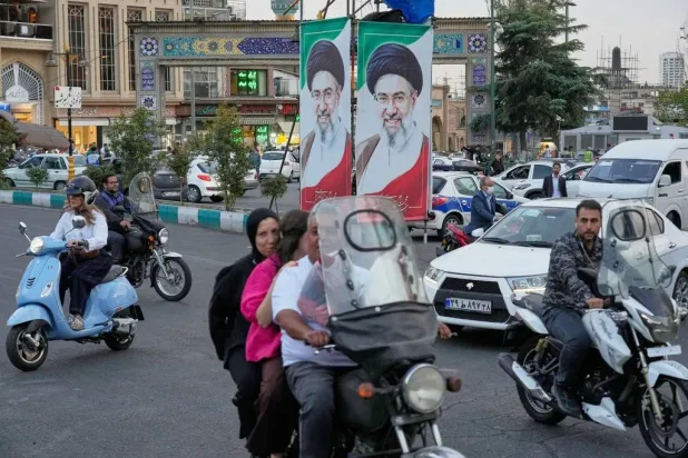 Motorists ride past portraits of Iran's Supreme Leader Mojtaba Khamenei in Tehran, Iran, Oct 21, 2026. (AP) 