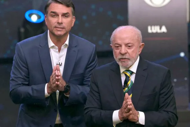 Brazil's incumbent leader Luiz Inacio Lula da Silva and his right-wing challenger Flavio Bolsonaro traded blows during a heated election debate. NELSON ALMEIDA / AFP
