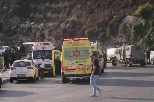  Israeli soldiers and emergency personnel gather near ambulances following a shooting attack near Yehuda Junction, near Hebron, in the occupied West Bank, Friday, Oct. 23, 2026. (AP) 