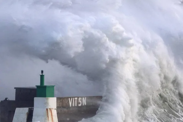 File photo: A huge wave crashes on the jetty of the harbor of Le Conquet in western France, on January 8, 2026.  Fred Tanneau, AFP
