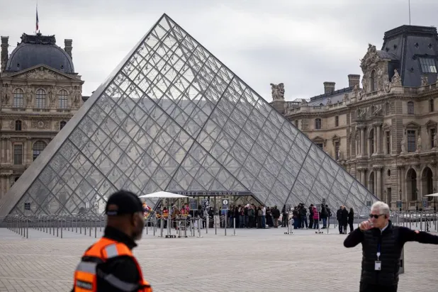 Visitors wait outside as protesters block the entrance to the Louvre Museum to express their support for the high school students' movement in Paris, France, 19 October 2026, two days after demonstrations and riots took place alongside nationwide cost-of-living protests. (EPA)