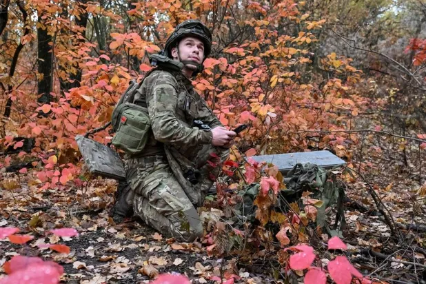 An artilleryman of the Special Rifle Police Battalion of Zaporizhzhia region sets up Starlink satellite internet system, at a position, amid Russia's attack on Ukraine, near the frontline in Donetsk region, Ukraine, October 16, 2026. (Reuters)