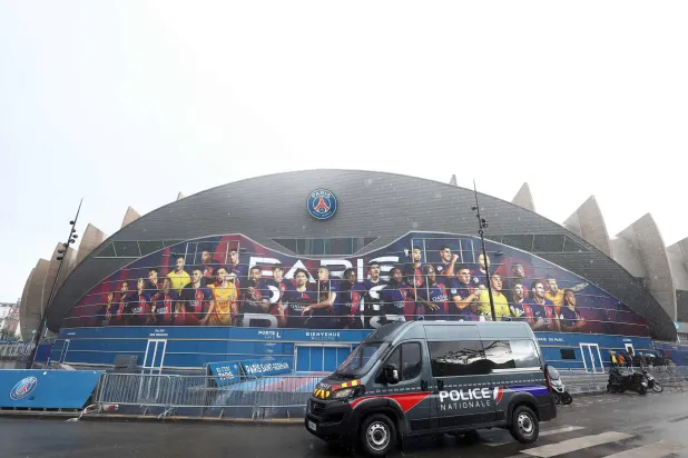 A French police vehicle is stationed outside the Parc des Princes stadium, in Paris on April 9, 2024, on the eve of the UEFA Champions League quarter-final first leg football match between Paris Saint-Germain and Barcelona. (AFP)