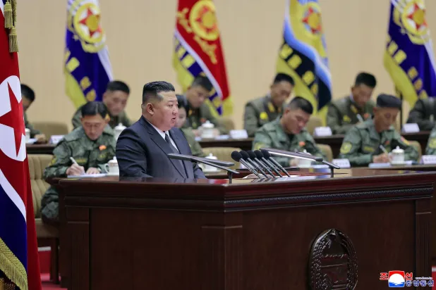 This picture taken between October 22 and 23, 2026 released by North Korea's official Korean Central News Agency (KCNA) on October 24, 2026 shows North Korean leader Kim Jong Un speaking during the third meeting of company leaders of the Korean People's Army at the Pyongyang Gymnasium in Pyongyang. (Photo by KCNA VIA KNS / AFP) 