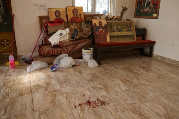 A bloodstain at Saint George’s Greek Orthodox Church, where gunmen opened fire during a funeral the previous day, in the village of Hamoud, Karak, Jordan, October 24, 2026. REUTERS/Alaa Al Sukhni