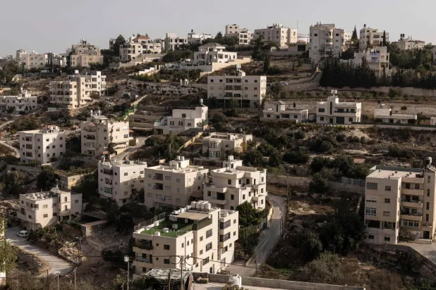 This picture shows empty residential buildings after the Israeli army forced Palestinians to evacuate the Ein Deir Baha neighborhood in occupied West Bank city of Hebron on October 24, 2026. (Photo by JOHN WESSELS / AFP)
