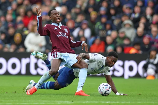 Aston Villa's Nicolas Jackson, left, challenges for the ball with Manchester City's Marc Guehi during the English Premier League soccer match between Aston Villa and Manchester City in Birmingham, England, Saturday, Oct. 24, 2026. (AP Photo/Morgan Harlow)