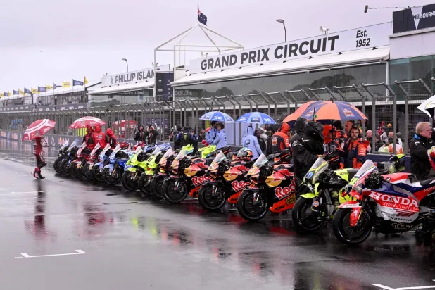 MotoGP bikes are seen lined up after a farewell lap following the cancellation of the last Australian MotoGP Grand Prix to be held at Phillip Island on October 25, 2026, due to inclement weather conditions. (AFP) 