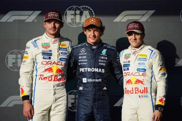  Pole winner Mercedes driver Kimi Antonelli, center, of Italy, poses with second place qualifier Red Bull driver Max Verstappen, left, of the Netherlands, and third place qualifier Red Bull driver Yuki Isack Hadjar, of France, following qualifying for the Formula One United States Grand Prix auto race in Austin, Texas, Saturday, Oct. 24, 2026. (AP)