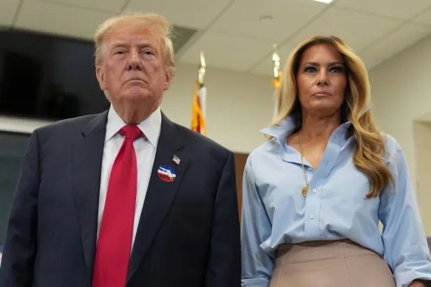  President Donald Trump, left, and first lady Melania Trump listen to a question from a reporter after casting their early-voting ballots for the 2026 midterm elections at the Palm Beach County Library in West Palm Beach, Fla., Saturday, Oct. 24, 2026. (AP) 