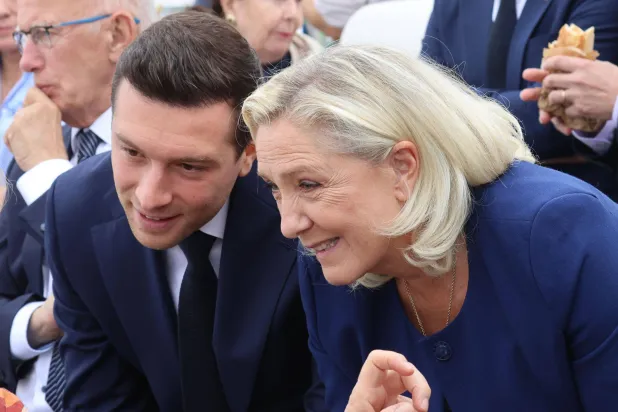 26 September 2026, France, Paris: Jordan Bardella and Marine Le Pen arrive at Place de la Concorde ahead of Pope Leo XIV's Mass in Paris. Photo: Pierre Teyssot / Agf/AGF via ZUMA Press/dpa