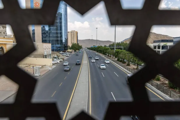 Vehicles drive along a road in Makkah on October 25, 2026. (AFP)