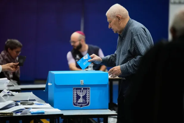 A man casts his ballot at a polling station during Israel's general election in Jerusalem, Tuesday, Oct. 27, 2026. (AP Photo/Ohad Zwigenberg)