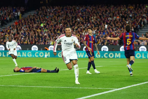 FILE PHOTO: Soccer Football - LaLiga - FC Barcelona v Real Madrid - Spotify Camp Nou, Barcelona, Spain - October 25, 2026 Real Madrid's Kylian Mbappe celebrates scoring their second goal REUTERS/Albert Gea/File Photo