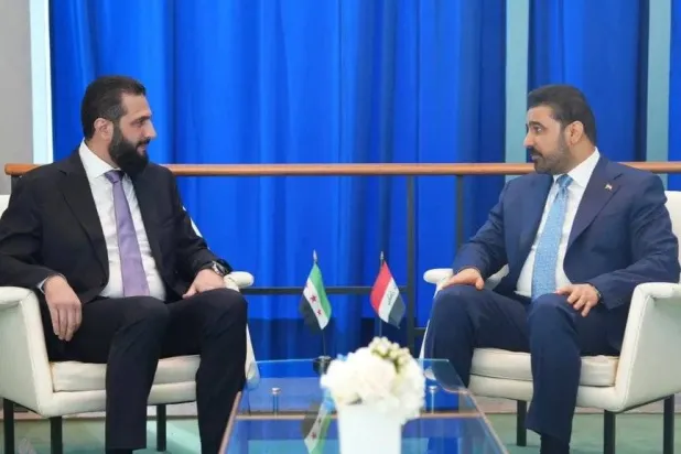 Syrian President Ahmad al-Sharaa and Iraqi Prime Minister Ali al-Zaidi meet at Damascus airport on Wednesday. (INA)