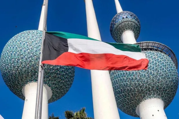 Kuwait's national flags are lowered to the half-mast position outside the landmark Kuwait Towers in Kuwait City on December 16, 2023, as the Gulf country mourns the death of its leader the late emir Sheikh Nawaf al-Ahmad Al Sabah. (AFP)
