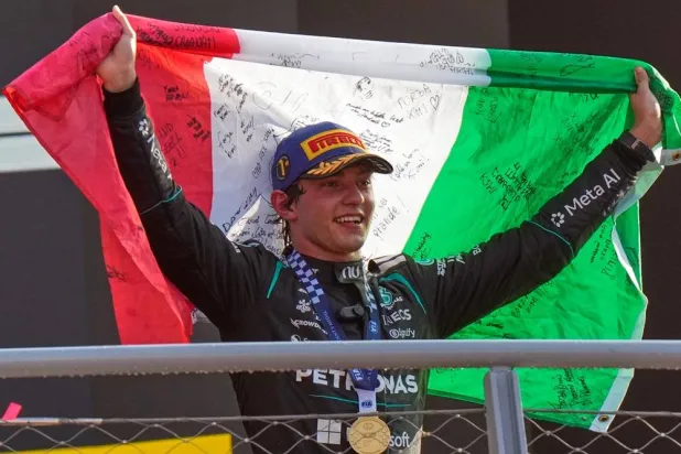 Mercedes driver Andrea Kimi Antonelli, of Italy, celebrates on the podium after winning the Italian Formula One Grand Prix race in Monza, Italy, Sept. 6, 2026. (AP)