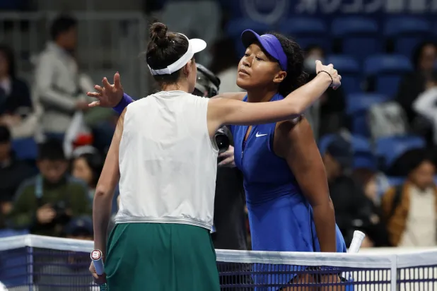 Tennis - WTA 500 - Pan Pacific Open - Ariake Coliseum, Tokyo, Japan - October 29, 2026 Slovakia's Mia Pohankova embraces Japan's Naomi Osaka after winning her round of 16 match REUTERS/Kim Kyung-Hoon