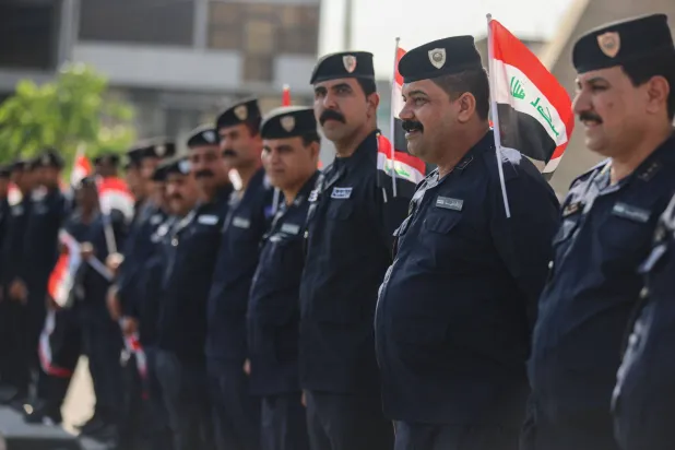 Police officers gather in Baghdad's Tahrir Square on October 25, 2026. (Photo by AHMAD AL-RUBAYE / AFP)