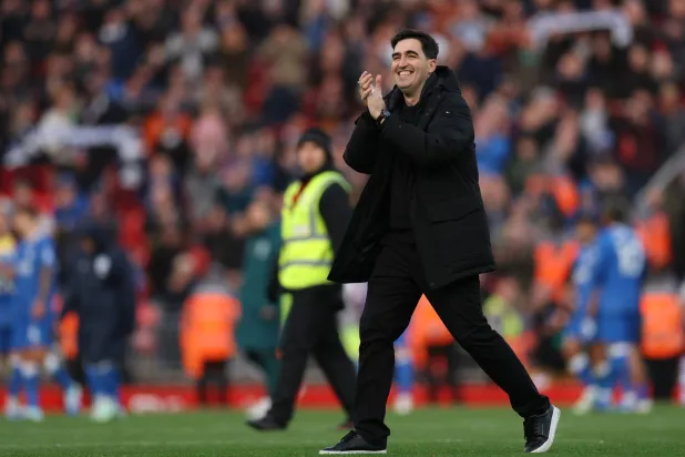 Liverpool manager Andoni Iraola applauds to supporters after winning the English Premier League match between Liverpool FC and Brighton & Hove Albion, in Liverpool, Britain, 25 October 2026. (EPA)