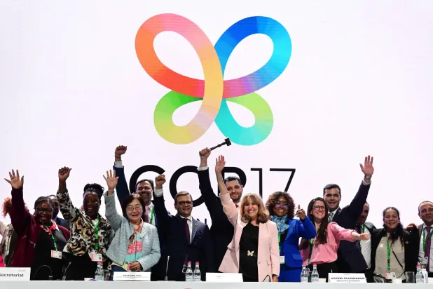 Executive Secretary of the United Nations Convention on Biological Diversity Astrid Schomaker (C-R), Armenia's Minister of Environment and COP17 President Hambardzum Matevosyan (C-L), Deputy Executive Secretary of the United Nations Convention on Biological Diversity Jihyun Lee (3rd L), and other members of the secretariat react during the closing session of the 17th meeting of the Conference of the Parties (COP17) in Yerevan on October 31, 2026. (AFP)