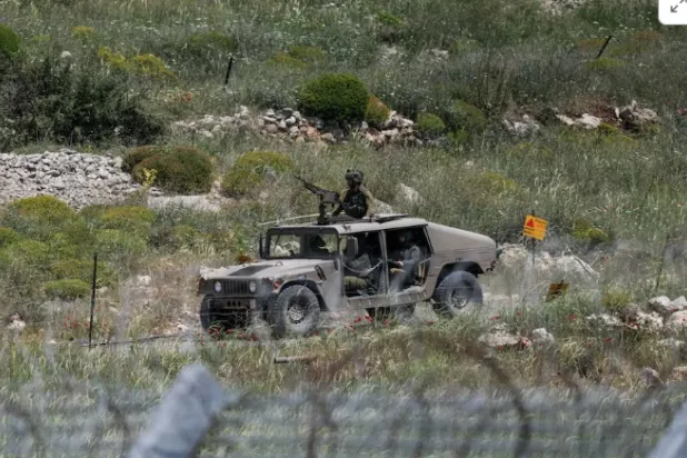 An Israeli military vehicle is seen near the border between the Israeli-occupied Golan Heights and Syria, May 4, 2025. REUTERS/Shir Torem/File Photo 