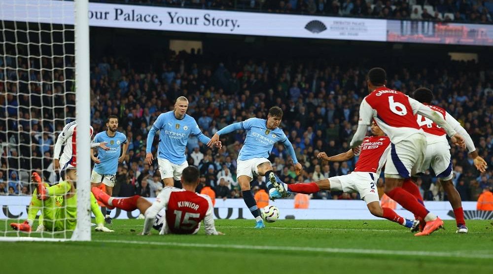 Football - Premier League - Manchester City v Arsenal - Etihad Stadium, Manchester, Britain - September 22, 2024 Manchester City's John Stones scores their second goal. (Reuters)