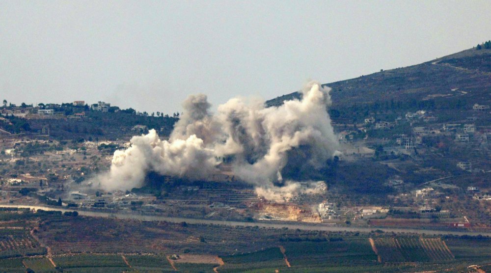 Smoke rises from Odeisseh in southern Lebanon, as seen from northern Israel, 17 October 2024. EPA/ATEF SAFADI