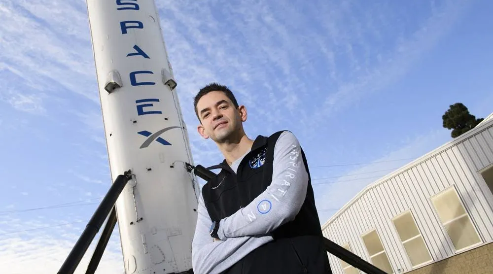 Inspiration4 mission commander Jared Isaacman, founder and chief executive officer of Shift4 Payments, stands for a portrait in front of the recovered first stage of a Falcon 9 rocket at Space Exploration Technologies Corp. (SpaceX) on February 2, 2021 in Hawthorne, California. (AFP) 
