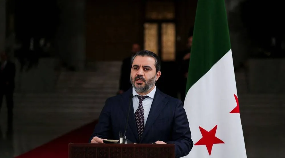 Syria's Foreign Minister Asaad Hassan al-Shibani speaks during a press conference with Ukrainian Foreign Minister Andrii Sybiha (not pictured), after the ousting of Syria's Bashar al-Assad, in Damascus, Syria, December 30, 2024. (Reuters) 