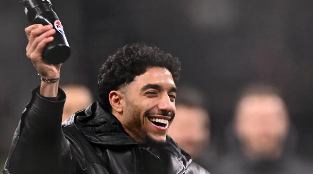Frankfurt's Egyptian forward #07 Omar Marmoush reacts after the German first division Bundesliga football match between Eintracht Frankfurt and Borussia Dortmund in Frankfurt am Main, western Germany on January 17, 2025. (Photo by Kirill KUDRYAVTSEV / AFP)