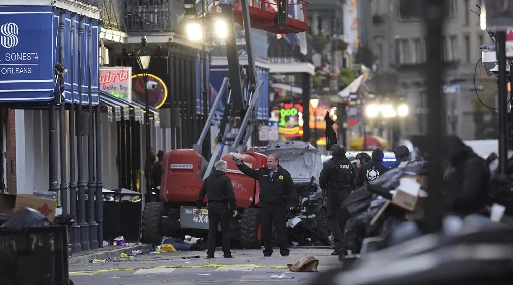 Emergency personnel work the scene on Bourbon Street after a vehicle drove into a crowd on New Orleans' Canal and Bourbon Street, Wednesday Jan. 1, 2025. (AP) 