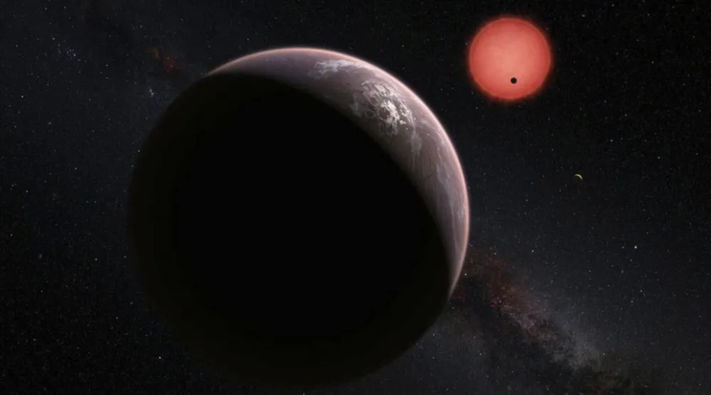 File Photo: An imagined view of the three planets orbiting an ultracool dwarf star just 40 light-years from Earth discovered using a specialist telescope at ESO's La Silla Observatoryin Chile. ESO/M. Kornmesser/N. Risinger

