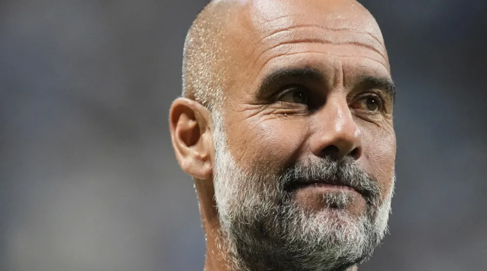 Manchester City manager Pep Guardiola reacts ahead of the Club World Cup Group G soccer match between Manchester City and Al Ain in Atlanta, Sunday, June 22, 2025. (AP Photo/Mike Stewart)